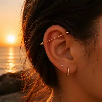 Industrial piercing bar με κωνικές άκρες σε χρυσό χρώμα NRI0017