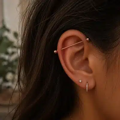Industrial piercing με σφαιρικές άκρες σε ροζ χρυσό χρώμα NRI0022